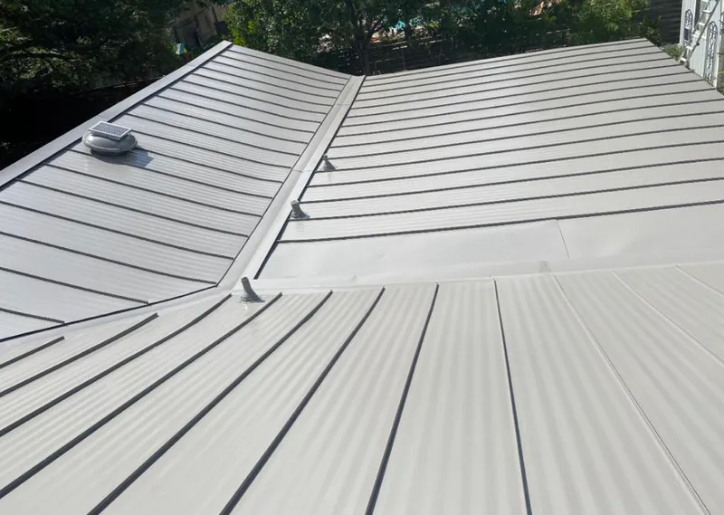 Solar attic fan installed on a metal roof for Roof Ventilation in Arkadelphia